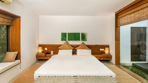 Kasara Chitwan Deluxe Villa - Schlafzimmer mit Doppelbett 