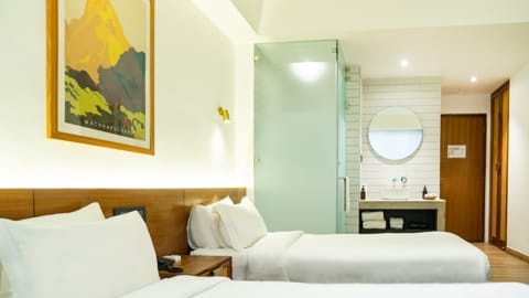 Nomad Hotel - Schlafzimmer mit zwei Betten
